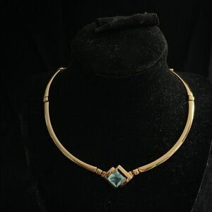 Elegant Gold Necklace with Blue Gemstone